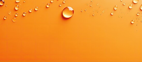 Orange background with droplets of water