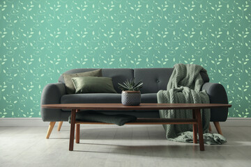 Wall Mural - Comfortable sofa and side table near wall. Minimalist living room interior