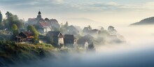 Village Of Cottages Engulfed In Morning Fog