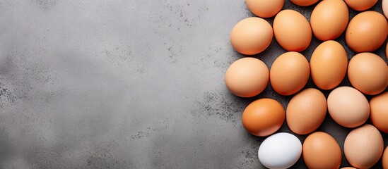 Fototapete - Farm eggs on a gray background Natural nutrition and farm products Top view flat lay copy space