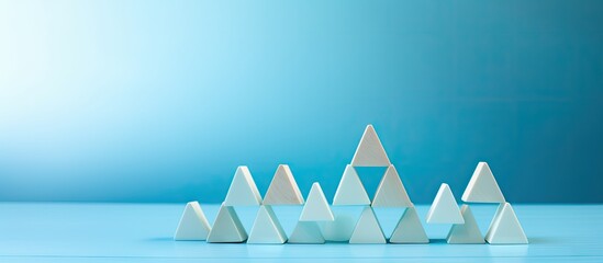 Poster - Text space available on light blue background with a pyramid of wooden cubes