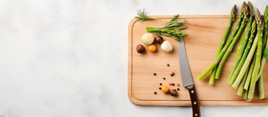 Wall Mural - Asparagus beans and a knife on wooden cutting board