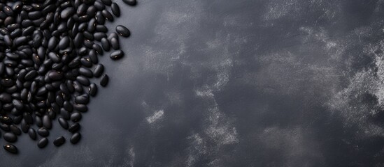 Aufkleber - Raw black beans on gray concrete horizontal top view blank area