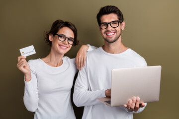 Wall Mural - Photo of positive sweet wife husband dressed white shirts eyewear online shopping modern device isolated brown color background