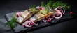 Pickled sea herring with onions and dill served ready to eat seafood contrasting colors and textures on a stone background Copy space available