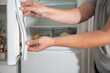 © HENADZY - Replacing the torn sealing rubber on the refrigerator door with a new rubber.