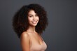 © Yuliia - Portrait beautiful attractive young cheerful happy positive African American brunette woman lady female girl smiling looking camera black background. Hydrated glowing skin care routine cosmetic beauty