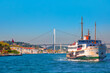© muratart - Sea voyage with old ferry (steamboat) on the Bosporus - Ortakoy mosque and Bosphorus bridge - Istanbul, Turkey