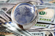 © Ruslan - glass globe on 100 dollar banknote