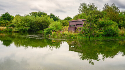 Sticker - Bird Hide at Branton Lakes, a Nature Reserve which was constructed from a former mineral quarry, located at Branton in the Breamish Valley, Northumberland