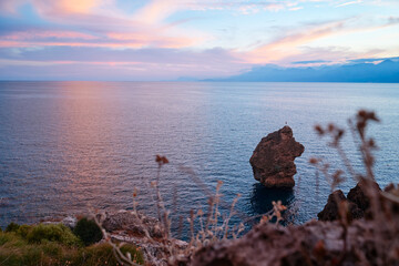 Wall Mural - Sea cliffs and rocks on the Antalya coast. Beautiful sunset landscape.