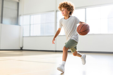 Wall Mural - Youthful Energy: Kid Dunking in an Indoor Gym