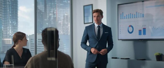 Aufkleber - Diverse Skyscraper Office: Caucasian Businessman Leads Meeting with Managers, Answers Questions, uses Presentation TV with Statistics. Digital Entrepreneurs Work on e-Commerce Project. Anamorphic Shot