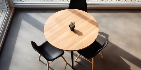 Poster - Round wooden table and black chair indoors, top view