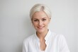 © Neil - a woman with white hair posing for picture in white outfit