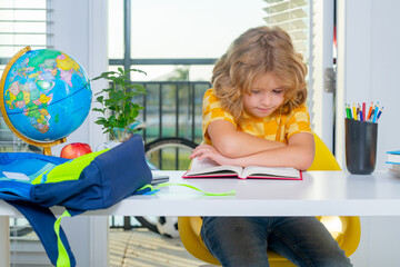 Aufkleber - Back to school. Child reading book. Funny little boy from elementary school doing homework. Education and homeschooling.