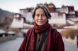© Markus Schröder - Medium shot portrait photography of a content mature woman wearing a comfy flannel shirt at the potala palace in lhasa tibet. With generative AI technology
