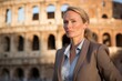 Photography in the style of pensive portraiture of a tender mature woman wearing a professional suit jacket against the colosseum in rome italy. With generative AI technology