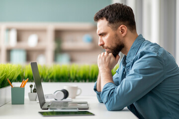 Aufkleber - Brainstorming Concept. Pensive Man Sitting At Desk And Looking At Laptop Screen