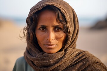 Poster - Photography in the style of pensive portraiture of a grinning girl in her 40s wearing a long-sleeved thermal undershirt at the socotra island in yemen. With generative AI technology