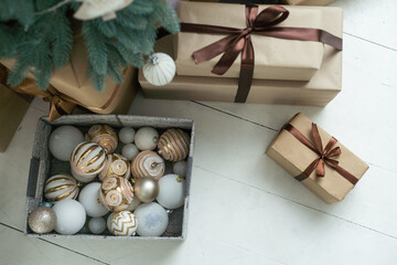 Wall Mural - Close-up of Christmas presents in wrapping paper are on the floor under the Christmas tree