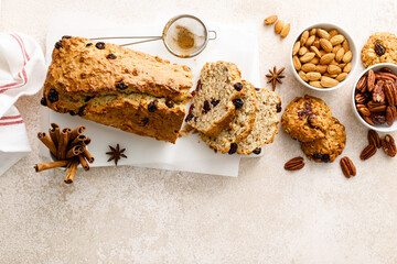 Poster - Fruitcake with cranberry, almond and pecan nuts sliced on a wooden board