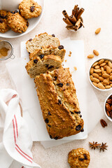 Poster - Fruitcake with cranberry, almond and pecan nuts sliced on a wooden board