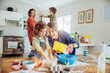 © Marko Geber - Young caucasian family being messy and having fun baking together in the kitchen
