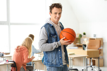 Poster - Male student with ball in classroom