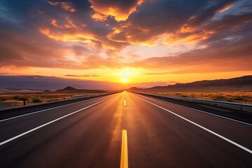 Road in the sunset, evening light, a flat, large asphalt road with stunning sky at sunset with clouds