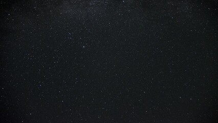 Wall Mural - the milky way galaxy moving in a night sky full of stars