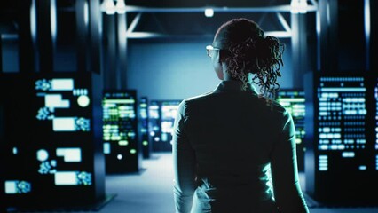 Poster - employee walking through data center infrastructure clusters providing processing resources for diff