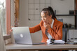 © M+Isolation+Photo - Young Asian business woman tax filing services auditor doing accounting and financial analysis on business reports stock market spreadsheet, tax preparation, budgeting, money management in office