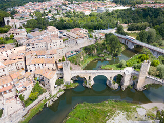 Wall Mural - Aerial view of historic centre of Besalu with Romanesque bridge over Fluvia river, Catalonia, Spain