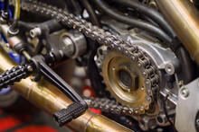 Closeup And Crop Motorcycle Engine Drive System With Chains And Sprockets