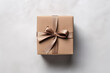 Square gift box with a bow on a white background