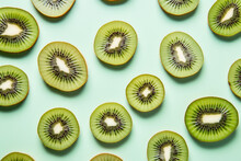 Top View Of Kiwi Fruit Slices On Light Blue Background.