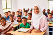 © the_lightwriter - muslim female teacher in front of her class