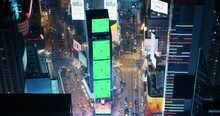 New York City Night Aerial Landscape With Manhattan Skyscrapers And Crowded Times Square Tourist Landmark. Cinematic Drone View With Green Screen Mock Up Billboards And Commercials With Neon Lights