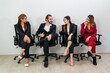 © kelvn - Successful business team, Smiling businesspeople having a discussion in an office