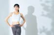 © metamorworks - トレーニングでウエストをシェイプアップした女性　ボディケア　ダイエット