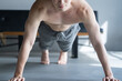 © kapinon - Man training push-ups, no frontal face