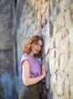 © Igor Borodin - Beautiful successful middle aged woman posing against a stone wall street, photo shoot