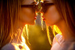 © Yevhen - Lesbian couple kissing on sunset time. Lesbian couple, lgbt people lifestyle concept. Pretty sexy stylish generation girls lgbtq. Close up portrait of two young woman sunglasses, long hairs