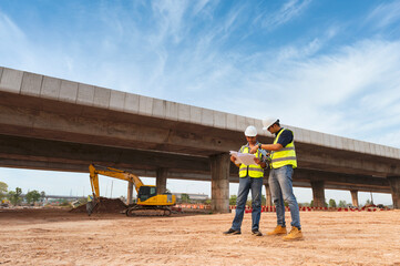 The chief civil engineer is introducing inspection of a road or expressway construction project under the road to an intern. At the expressway construction site