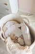 © shine.graphics - Outfit for a newborn in a baby cradle, concept in anticipation