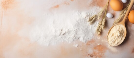 Poster - Baking preparations with eggs and a wooden spoon on a flour background making homemade food by kneading dough isolated pastel background Copy space