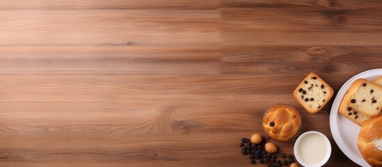 Poster - Bakery with bread raisins and a plate on a wooden floor Many raisins on a white plate isolated pastel background Copy space