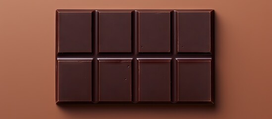 Closeup of two dark chocolate bars on a isolated pastel background Copy space