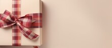 Close Up Of Two Checkered Gift Boxes With A Red Violet Ribbon And Bow Isolated On A Isolated Pastel Background Copy Space